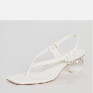 SOLD
Cult Gaia white Aviva leather sling back sandal. Spherical transparent heel
